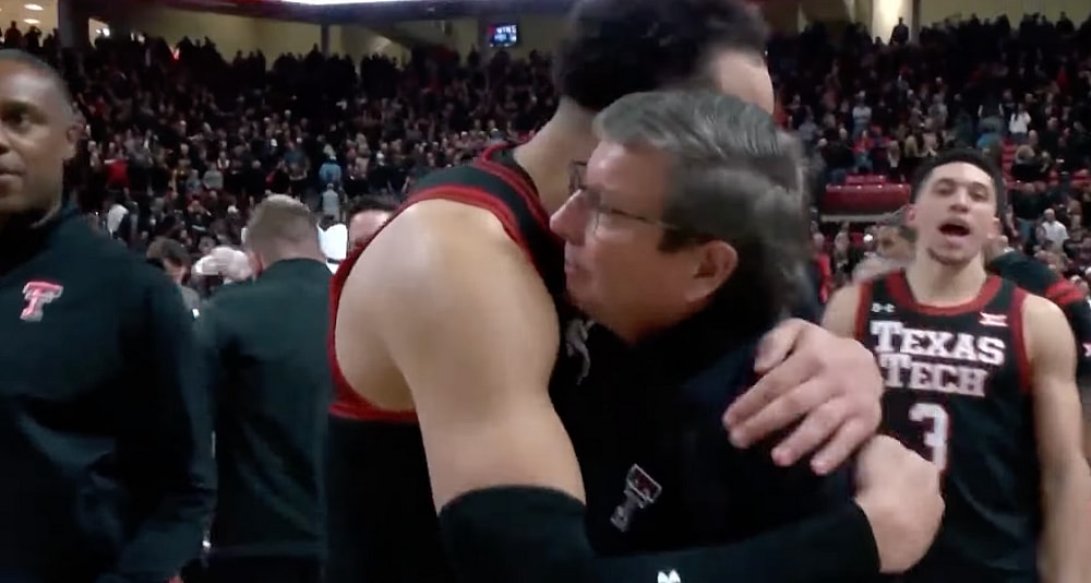 Mark Adams Embraces Player after Texas Tech Win