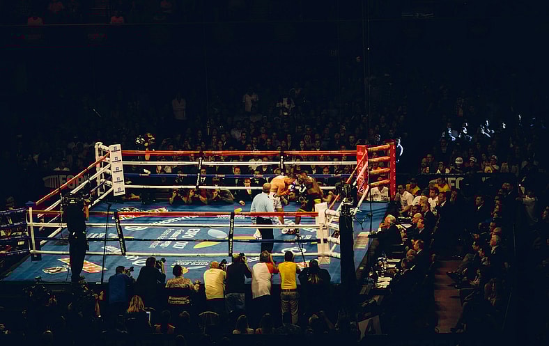 fight in blue boxing ring
