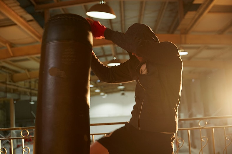 guy hitting punching bag