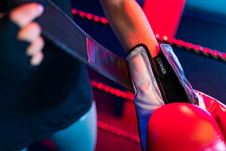 wrapping up red boxing gloves