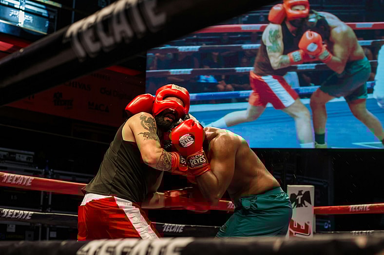 two boxers fighting in red gear