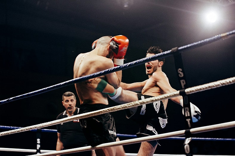 men fighting in boxing ring