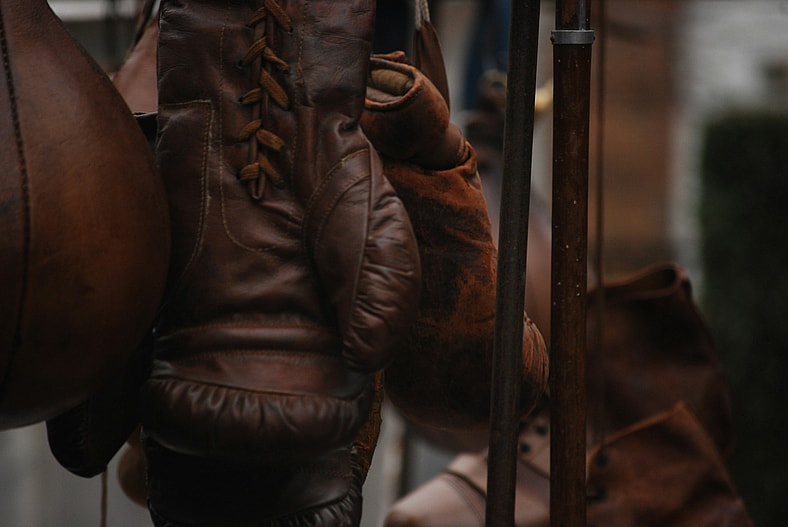 old brown leather boxing gloves