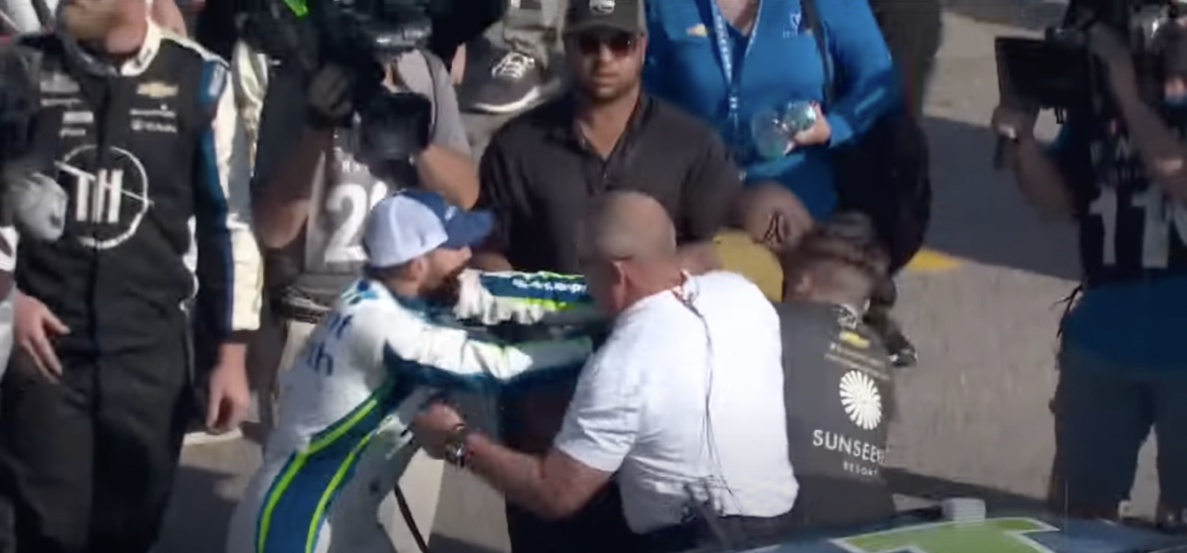 NASCAR drivers Ross Chastain and Noah Gragson brawl at Kansas Speedway after race.