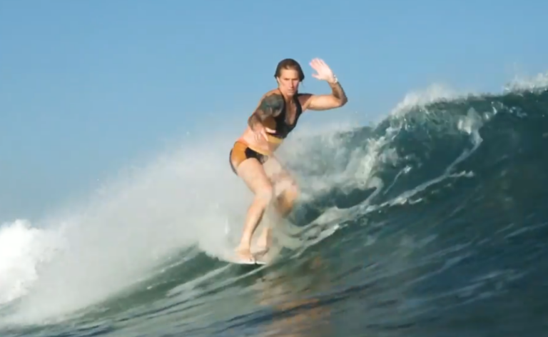 Sasha Lowerson, a male surfer competing against women