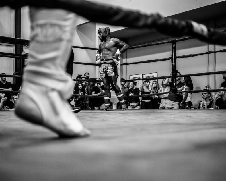 two men fighting in boxing ring