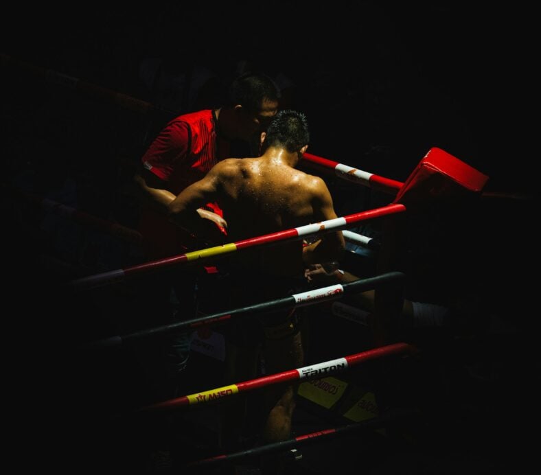 man standing in corner of boxing ring
